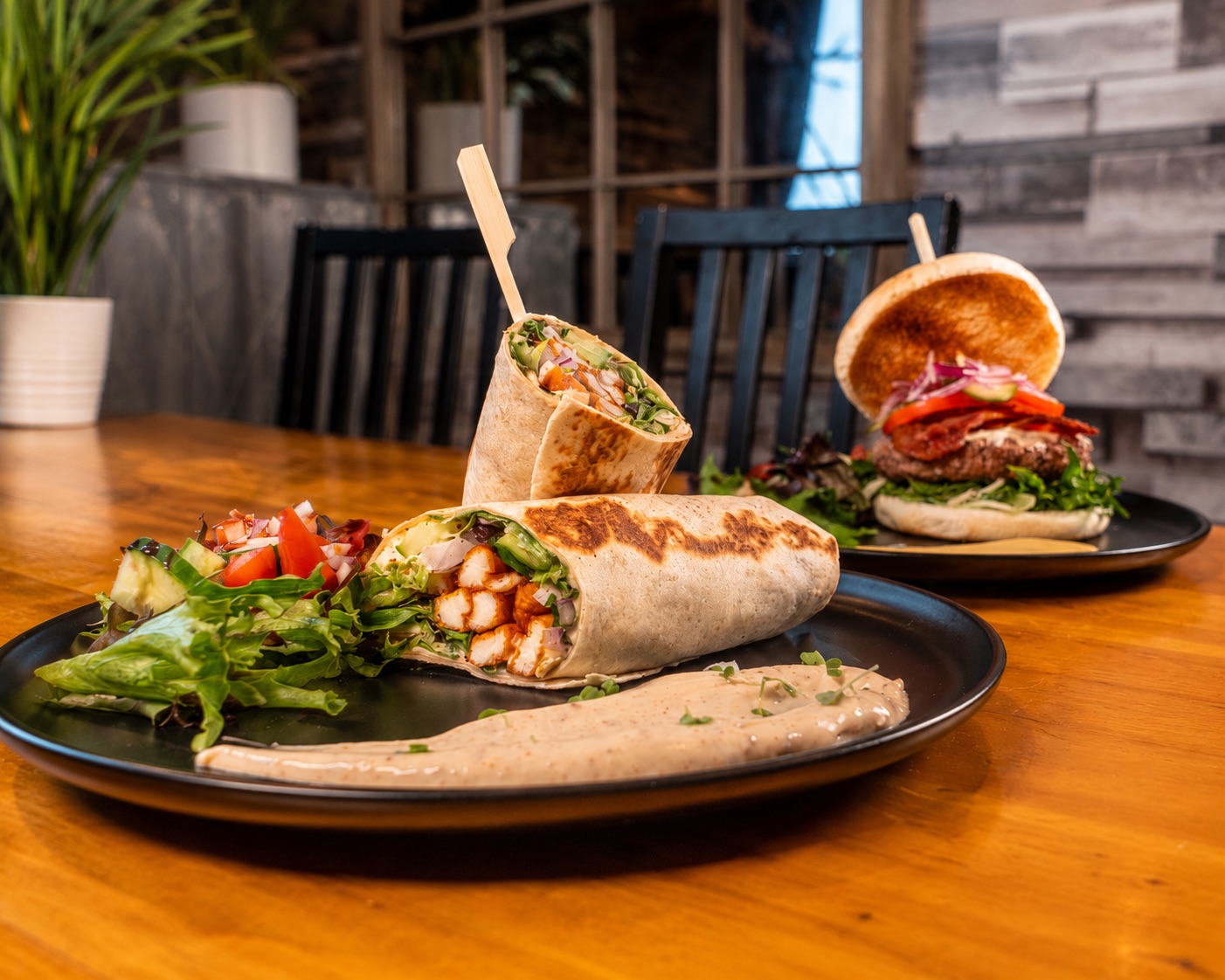 Fresh wraps and a burger served with salad at Heaven Coffee Shop.